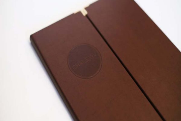 This menu was made for Chai Wu an asian fusion venue in Harrods. Nice bonded leather with brass corners and circular de-bossed logo.