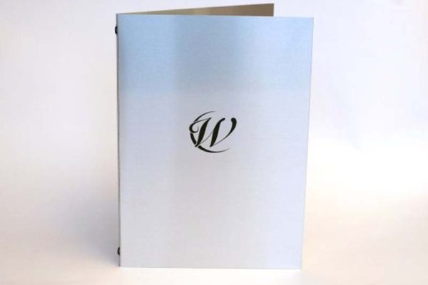 Plain and simple Aluminium metal menu covers with elastic in the spine to hold A3 pages folded to A4. Black screen printed logo finishes the design nicely.