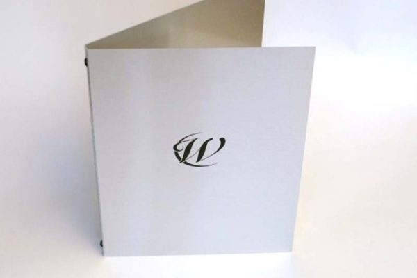 Plain and simple Aluminium metal menu covers with elastic in the spine to hold A3 pages folded to A4. Black screen printed logo finishes the design nicely.